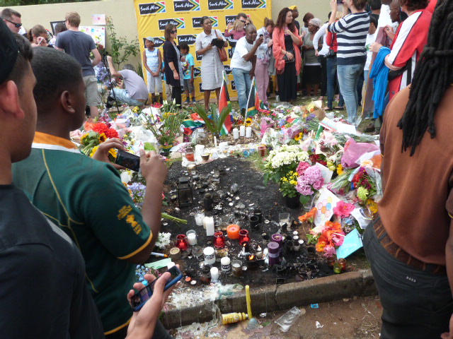 Candles, cards and flowers outside the home 